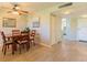 Cozy dining area featuring wood table set and tiled flooring near front door at 6151 Bahia Del Mar Blvd # 123, St Petersburg, FL 33715