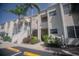 Inviting condo exterior featuring well-manicured landscaping and convenient parking at 6151 Bahia Del Mar Blvd # 123, St Petersburg, FL 33715