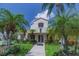 A well-maintained exterior with lush landscaping, flowers and palm trees at 6151 Bahia Del Mar Blvd # 123, St Petersburg, FL 33715