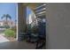 Relaxing front porch with three rocking chairs on a tiled floor with lush landscaping nearby at 6151 Bahia Del Mar Blvd # 123, St Petersburg, FL 33715