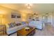 Comfortable living room with hardwood floors, neutral tones, and ample natural light at 6151 Bahia Del Mar Blvd # 123, St Petersburg, FL 33715