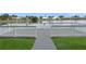 Community deck with a pristine railing and a calming lake view, providing a serene retreat at 6664 Deering Cir, Sarasota, FL 34240