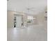 Bright foyer with high ceilings, tile flooring, and a view of the front entrance at 6664 Deering Cir, Sarasota, FL 34240