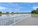 Breathtaking lake view from the community deck with a white railing and neighborhood homes visible at 6664 Deering Cir, Sarasota, FL 34240