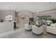 Bright and airy living room with tile floors and a sliding glass door leading to an outdoor patio at 6664 Deering Cir, Sarasota, FL 34240