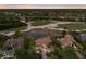Aerial image showing property with lake and golf course views in a neighborhood with mature trees at 6919 Westchester Cir, Lakewood Ranch, FL 34202