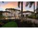 Elegant two-story home featuring a paved driveway, manicured landscaping, and a stately facade at 6919 Westchester Cir, Lakewood Ranch, FL 34202