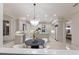 Gourmet kitchen with stainless steel appliances, custom cabinets, and center island at 6919 Westchester Cir, Lakewood Ranch, FL 34202