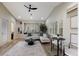 A bright living room with comfortable seating, built-in shelves, and plenty of natural light at 6919 Westchester Cir, Lakewood Ranch, FL 34202