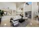 Spacious living room with high ceilings, modern furniture, and an open floor plan to the kitchen at 6919 Westchester Cir, Lakewood Ranch, FL 34202
