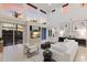 Bright living room with high ceilings, white furniture, and a large sliding door to outdoor space at 6919 Westchester Cir, Lakewood Ranch, FL 34202
