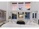 Bright living room boasts soaring ceilings, oversized windows, and elegant decor at 6919 Westchester Cir, Lakewood Ranch, FL 34202