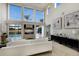 Open living room with a view of the pool, modern furniture, and large windows at 6919 Westchester Cir, Lakewood Ranch, FL 34202