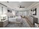 Spacious main bedroom features a bay window with plantation shutters, decorative rug, and designer furnishings at 6919 Westchester Cir, Lakewood Ranch, FL 34202