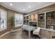 Bright home office with custom built-ins, modern furniture, and natural light from plantation-shuttered windows at 6919 Westchester Cir, Lakewood Ranch, FL 34202
