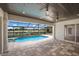 Covered patio with view of the screened pool and spa, and view of golf course at 6919 Westchester Cir, Lakewood Ranch, FL 34202