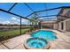 Screened pool with spa, fountain features, and view of golf course at 6919 Westchester Cir, Lakewood Ranch, FL 34202
