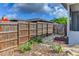 Backyard with a wooden fence and stone garden at 7719 9Th Avenue Nw Dr, Bradenton, FL 34209