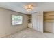 Bedroom featuring carpeted floors, a window, and closet space at 7719 9Th Avenue Nw Dr, Bradenton, FL 34209