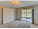 Bedroom featuring built-in shelving and sliding glass doors leading to a patio at 7719 9Th Avenue Nw Dr, Bradenton, FL 34209