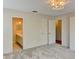 Bedroom leading to a bathroom and closet at 7719 9Th Avenue Nw Dr, Bradenton, FL 34209