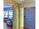 Inviting entryway leading to a cozy living room with a comfortable couch and sunlit window at 7719 9Th Avenue Nw Dr, Bradenton, FL 34209