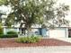 Charming single-story home with well-maintained landscaping and an attached two-car garage at 7719 9Th Avenue Nw Dr, Bradenton, FL 34209