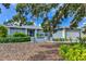 Charming single-story home featuring a manicured lawn, tidy landscaping, and an attached two-car garage at 7719 9Th Avenue Nw Dr, Bradenton, FL 34209