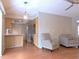 View of kitchen with stainless steel appliances and an attached living area at 7719 9Th Avenue Nw Dr, Bradenton, FL 34209