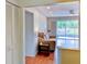 Bright living room featuring hardwood floors and large sliding doors to the back patio at 7719 9Th Avenue Nw Dr, Bradenton, FL 34209