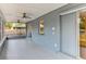 Enclosed patio with ceiling fans and view to the yard at 7719 9Th Avenue Nw Dr, Bradenton, FL 34209