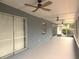 Screened in outdoor patio with ceiling fans and sliding doors for year-round comfort at 7719 9Th Avenue Nw Dr, Bradenton, FL 34209