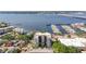 Fantastic aerial view showcasing a building with a marina, bay views, and lush green trees at 1400 1St W Ave # 203, Bradenton, FL 34205