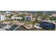 Stunning aerial view of a coastal city with a marina, waterfront condos, and lush green landscaping at 1400 1St W Ave # 203, Bradenton, FL 34205