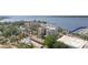 Picturesque aerial view highlighting a building with a marina, bay views, and lush green trees at 1400 1St W Ave # 203, Bradenton, FL 34205