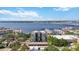 Amazing aerial view showcasing a building with a marina, water views, and lush green surroundings at 1400 1St W Ave # 203, Bradenton, FL 34205