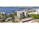 Attractive aerial view showcasing a building with a marina, river views, and lush green surroundings at 1400 1St W Ave # 203, Bradenton, FL 34205