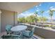 Cozy balcony area with seating and views of the waterway and marina at 1400 1St W Ave # 203, Bradenton, FL 34205