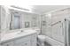 Clean bathroom with white tile shower, glass door, and spacious vanity at 1400 1St W Ave # 203, Bradenton, FL 34205