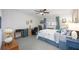 Bedroom featuring a ceiling fan and workspace area with a desk and filing cabinet at 1400 1St W Ave # 203, Bradenton, FL 34205