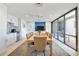 Contemporary dining room with modern furniture, ample lighting, and views of the outdoor patio at 1400 1St W Ave # 203, Bradenton, FL 34205
