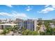 Condo building featuring multiple balconies and well-maintained landscaping at 1400 1St W Ave # 203, Bradenton, FL 34205