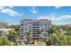 Condo building featuring multiple balconies and well-maintained landscaping at 1400 1St W Ave # 203, Bradenton, FL 34205