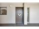 Inviting entryway with a decorated front door and sidelight windows at 1400 1St W Ave # 203, Bradenton, FL 34205