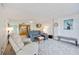 Inviting living room with a view into the kitchen and comfortable seating at 1400 1St W Ave # 203, Bradenton, FL 34205
