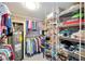 Organized walk-in closet with plentiful wire shelving, also features water heater for efficient storage space at 1400 1St W Ave # 203, Bradenton, FL 34205