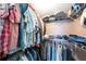 Walk-in closet features wire shelving and well-organized clothing, offering ample storage space at 1400 1St W Ave # 203, Bradenton, FL 34205
