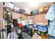 Cluttered walk-in closet featuring wire shelving and various stored items, showcasing available storage area at 1400 1St W Ave # 203, Bradenton, FL 34205