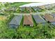 Aerial view of homes with pools, offering a glimpse of backyard living at 15605 Derna Ter, Bradenton, FL 34211