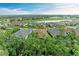Scenic aerial view of new homes with golf course and lake views in desirable community at 15605 Derna Ter, Bradenton, FL 34211